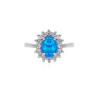 Sterling silver halo ring with blue opal