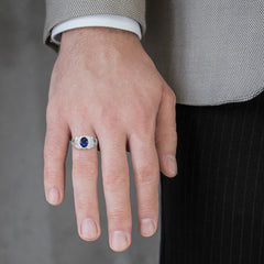 Silver halo ring with sapphire center