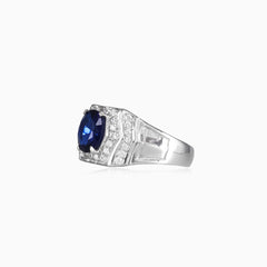Silver halo ring with sapphire center