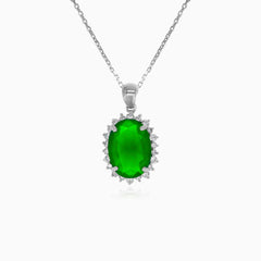 Halo sterling silver pendant with oval emerald