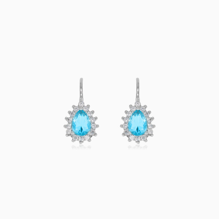 Boucles d'oreilles pendantes en argent sterling avec topaze taille poire et halo.