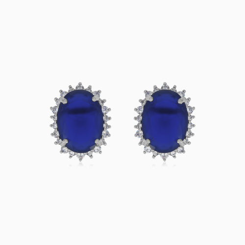 Halo oval cut sapphire on sterling silver earrings