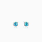 Sterling silver halo stud earrings with blue topaz