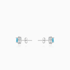 Sterling silver halo stud earrings with blue topaz