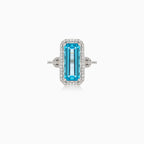 Elegantní prsten s modrým topazem z bílého zlata
