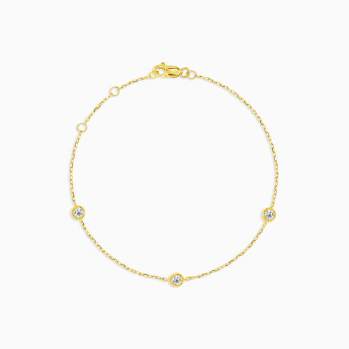 Golden bezel diamond station bracelet