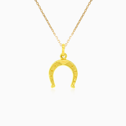 Gold horseshoe pendant