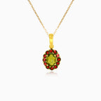 Stylish 14kt gold pendant with moldavite and garnet