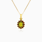 Royal Radiance in yellow gold with moldavite oval cut and garnet round stone