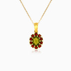 Elegant 14kt gold pendant with moldavite and garnet