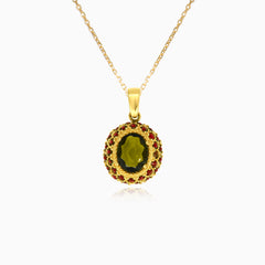 Éclat envoûtant en or jaune avec pierre de moldavite et entourage de grenat