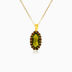 Radiant Fusion Pendant In Yellow Gold With Oval Moldavite And Round Garnet