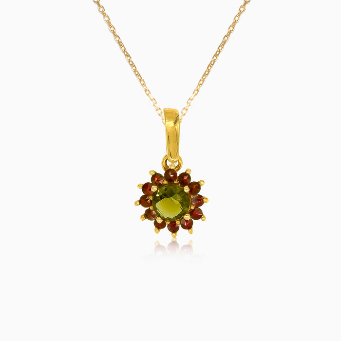 Florale Strahlkraft in Gelbgold mit Moldavit- und Granatstein