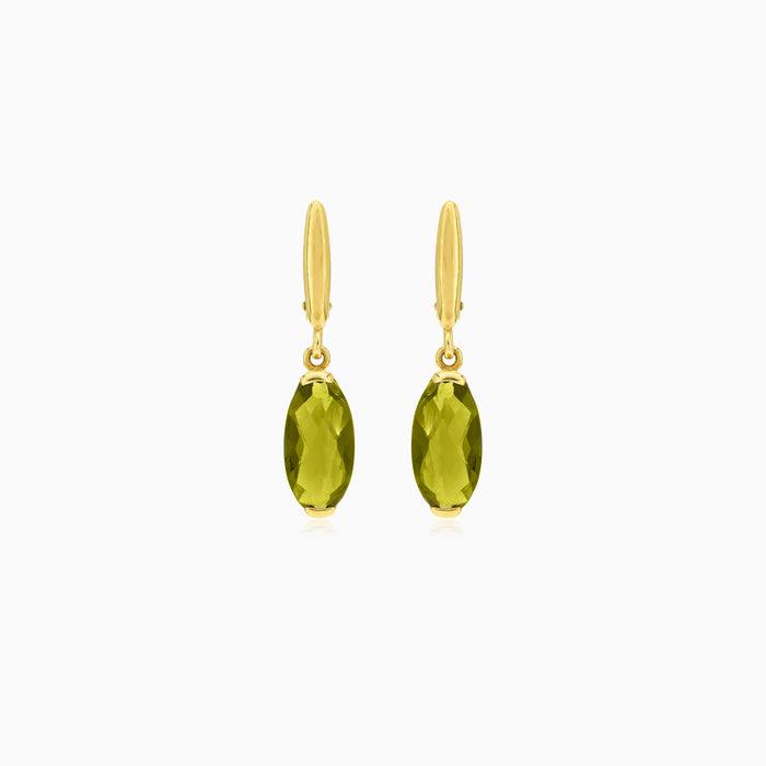 Oval cut modavite in gold earrings
