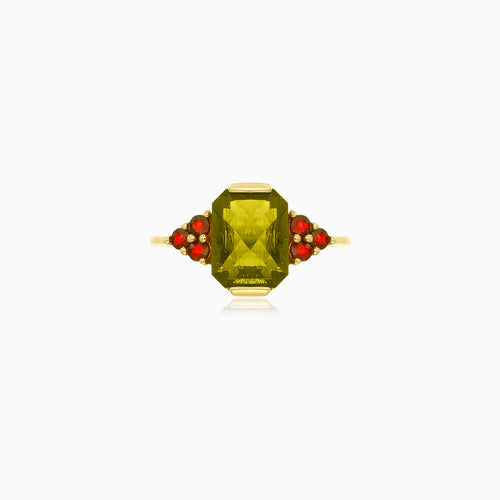 Zlatý prsten s obdélníkovým vltavínem a kulatými granáty