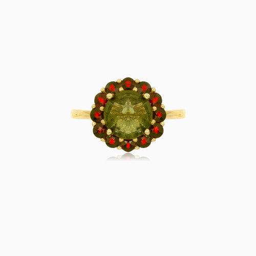 Prsten s vltavínem a granáty v designu květiny