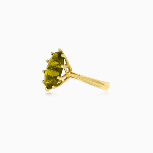 Oval moldavite gold ring with ten prongs