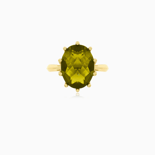 Oval moldavite gold ring with ten prongs