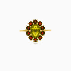 Zltý prsten inspirovaný květinou s vltavínem a granáty