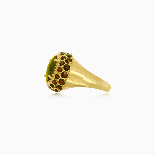 Masivní zlatý prsten s vltavínem a granáty