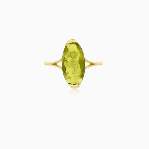 Oval cut modavite in gold ring