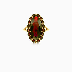 Elegant oval and round garnet ring