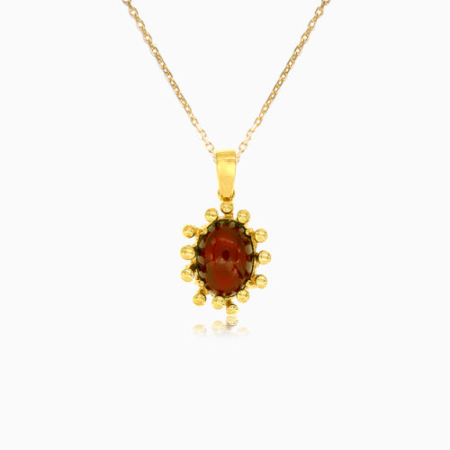 Garnet oval fine step cut gold pendant