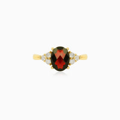 Elegant gold ring with garnet and cubic zirconia