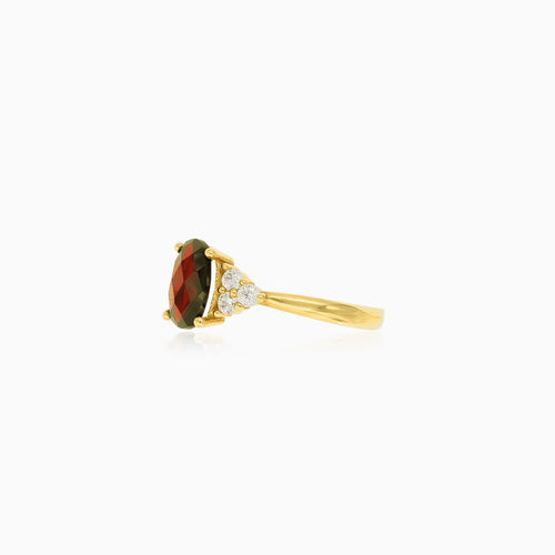 Elegant gold ring with garnet and cubic zirconia