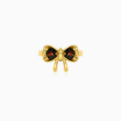 Feminine bow design garnet ring