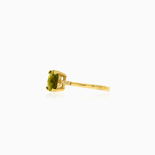 Moldavite and cubic zirconia gold ring