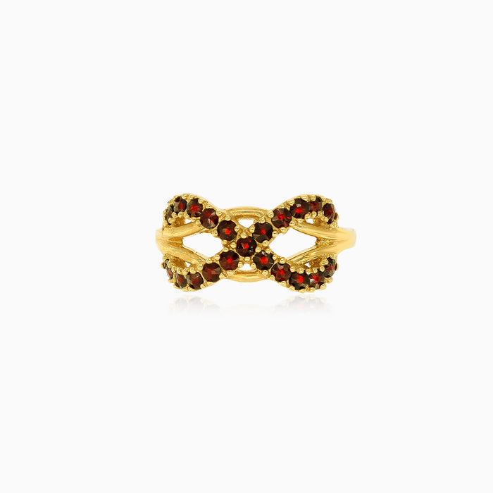 Anillo de oro con símbolo de infinito y granate