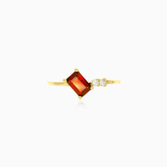 Emerald step cut garnet ring with cubic zirconia