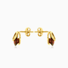 Eclipse tension round garnet stud earrings