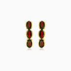 Three garnet oval step cut earrings