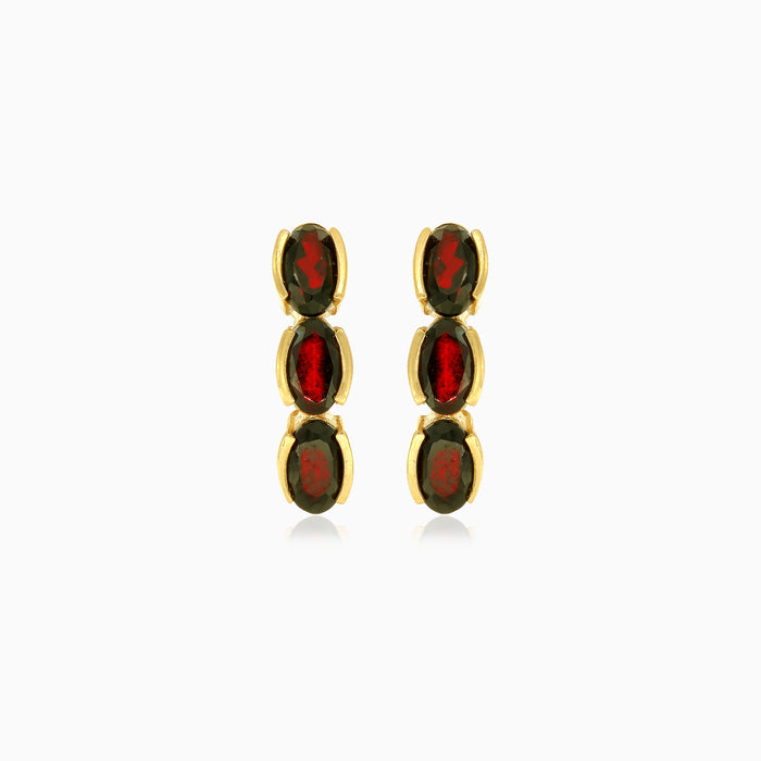 Three garnet oval step cut earrings