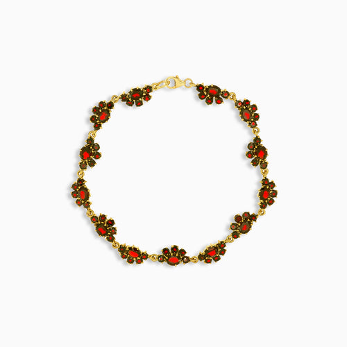 Gold garnet bracelet with floral accents