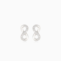 Silver infinity earrings with half-covered cubic zirconia