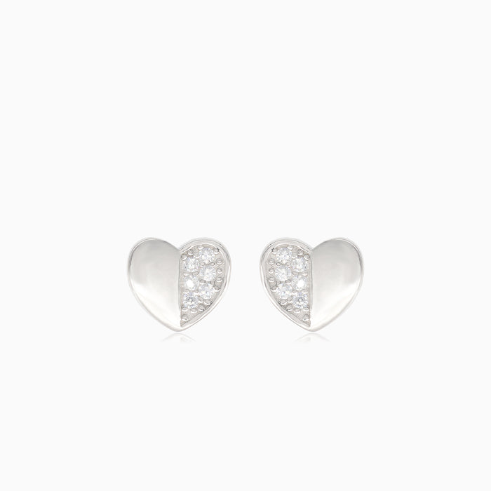 Silver heart earrings with half-covered cubic zirconia