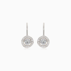 Silver earrings with large cubic zirconia, surrounding smaller cubic zirconia