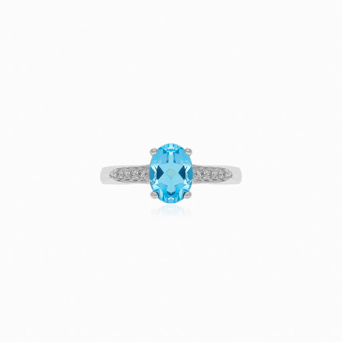 Anillo de plata con topacio azul y circonita cúbica
