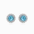 Silver stud earrings with round topaz