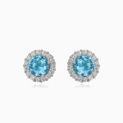 Silver stud earrings with round topaz