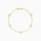 Yellow gold women chain bracelet with mother of pearl hearts
