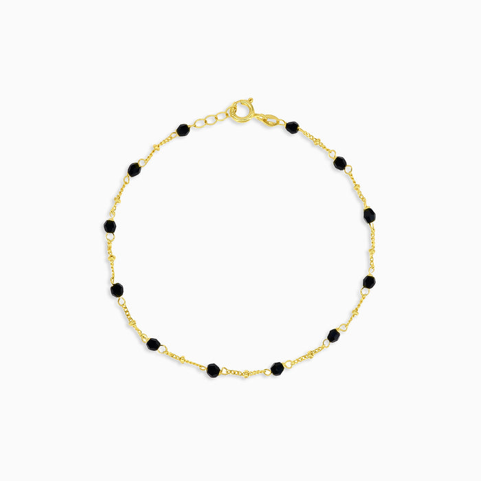 Elegante pulsera de oro con ónix negro