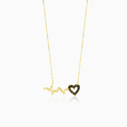 Yellow gold necklace with black onyx heart