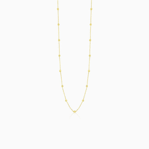 Elegant gold necklace with little balls