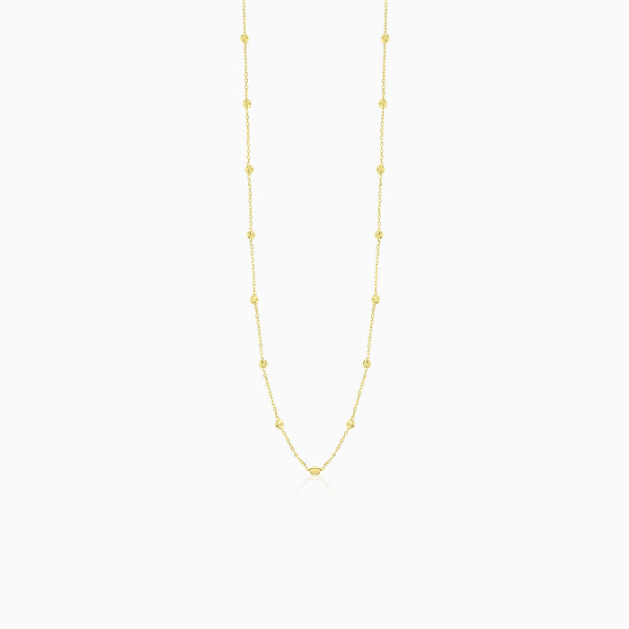 Elegant gold necklace with little balls