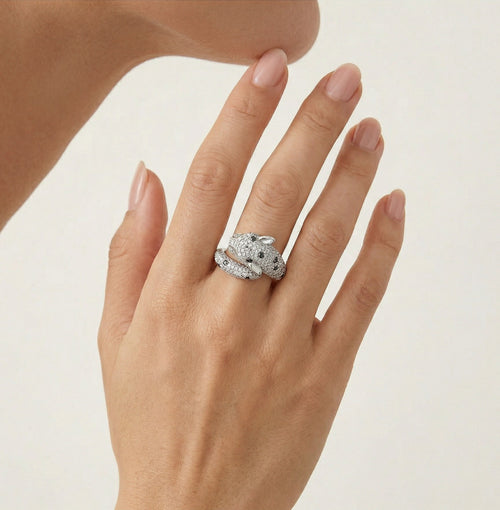 Whimsical panther inspired ring with diamond and blue sapphire