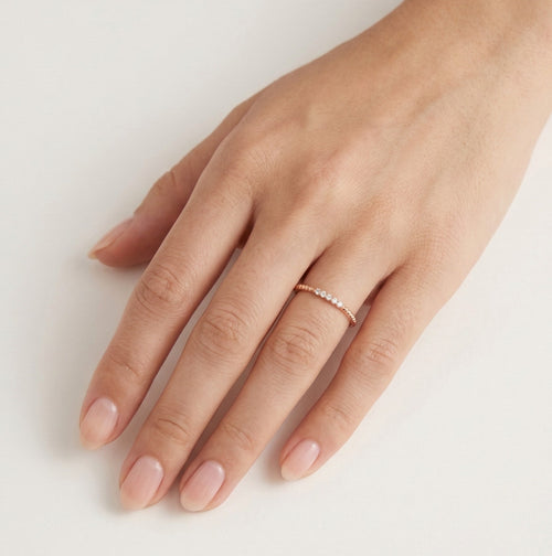 Tiny twisted rose gold ring